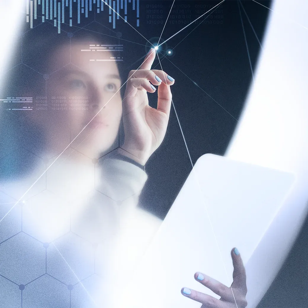 A businesswoman using her laptop and touching the screen, with data visualizations of graphs floating above it.