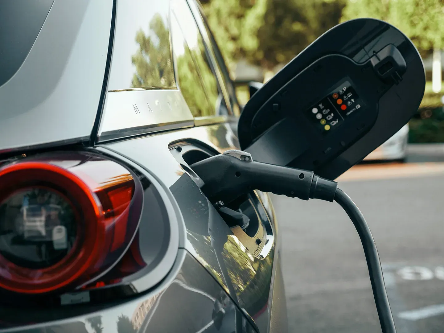 Close-up of an electric car charging.