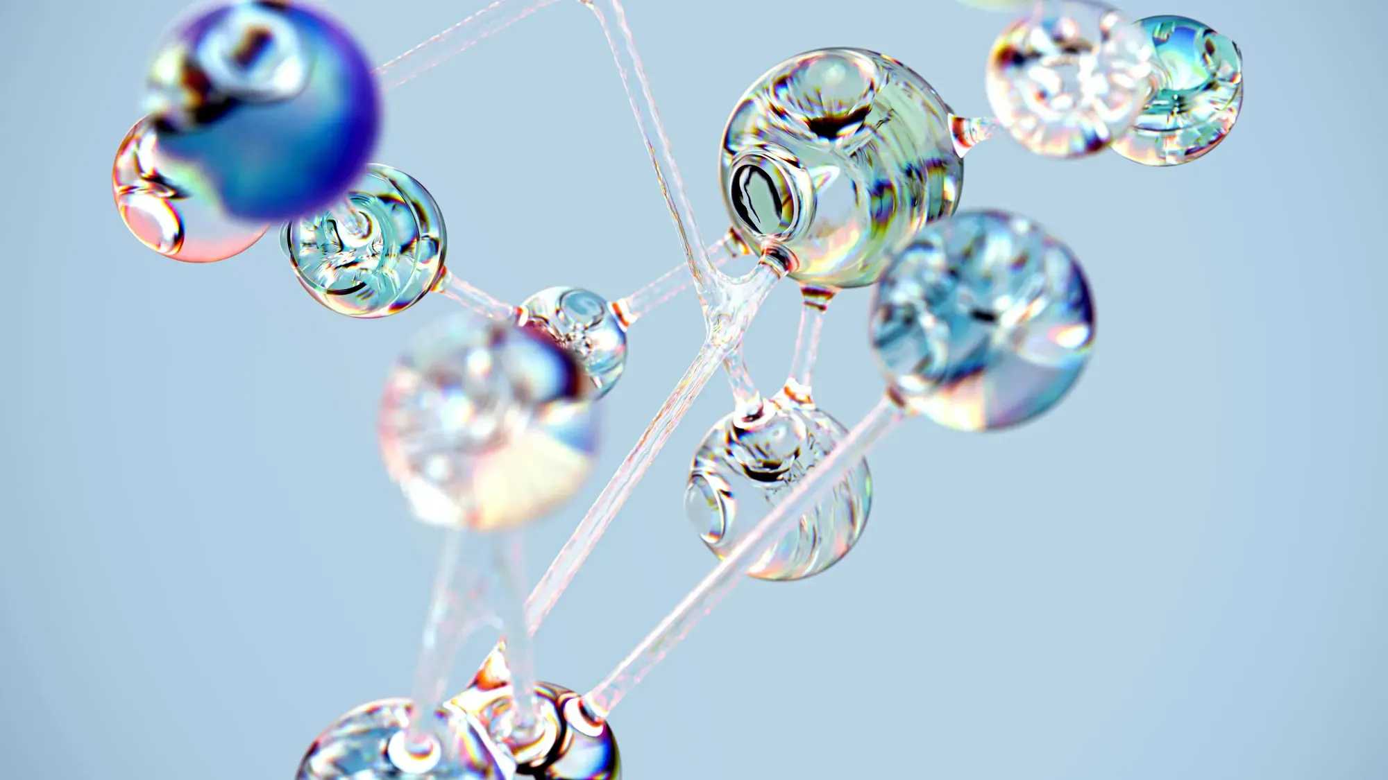 Macro photography of an interconnected network made up of glass spheres, each containing multiple smaller bubbles, suspended in the air against a light blue background, with soft lighting casting gentle shadows on their delicate forms, creating intricate patterns and reflections, symbolizing connectivity within a complex system.