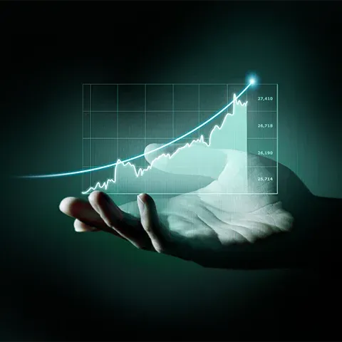 A stock market graph with an upward trend is held in the palm of one hand, symbolizing financial growth and progress. The background is dark green to emphasize themes related to business or finance.